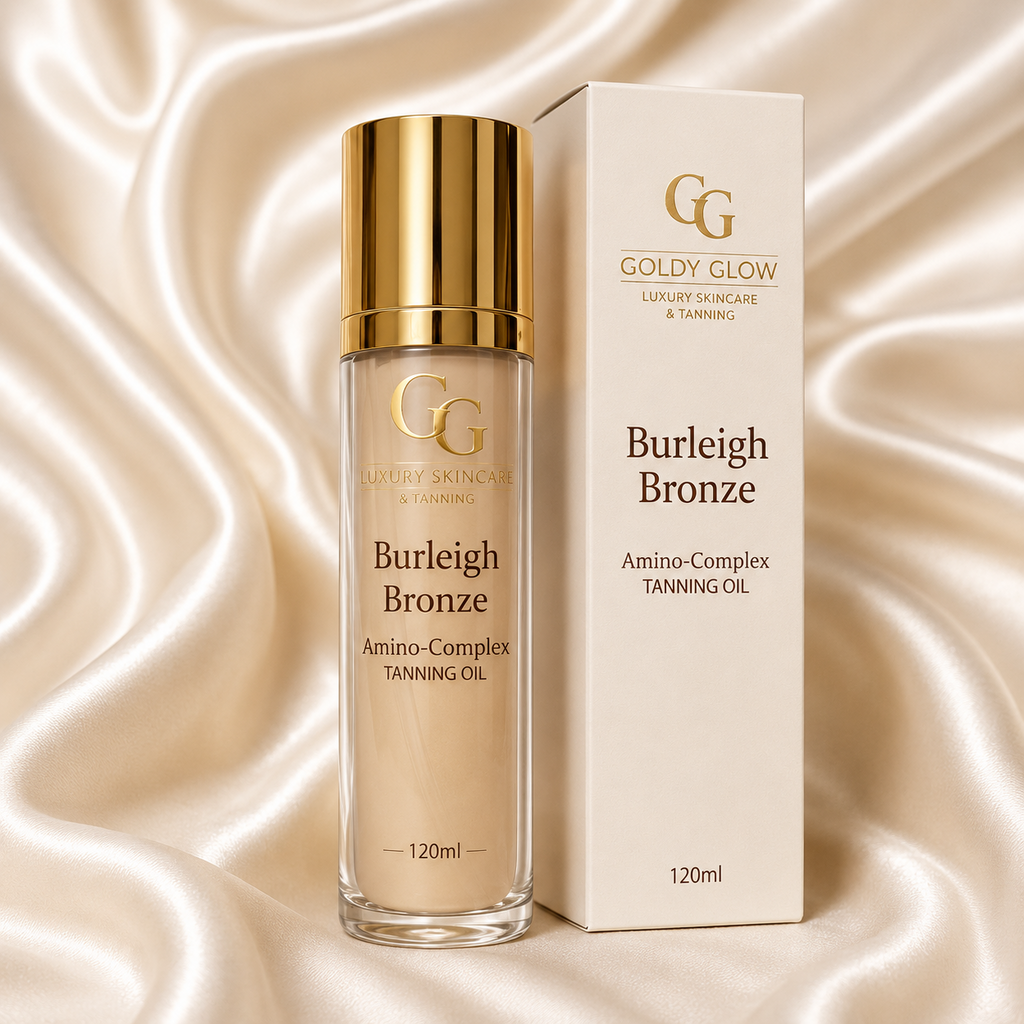 Goldy Glow Burleigh Bronze Amino-Complex Peptide Tanning Oil with luxury retail box displayed on a white silk background.